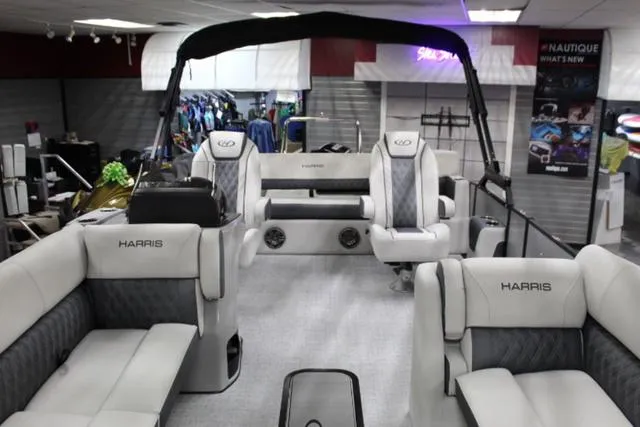 Slide: The Image of 2024 Harris Sunliner 250 SLDH pontoon boat interior with luxurious seating and modern design. - 6