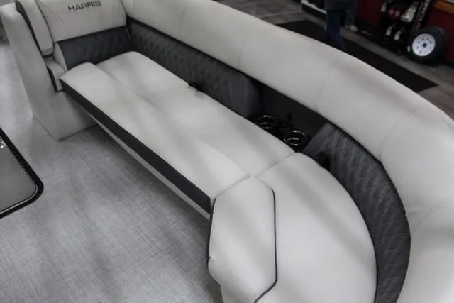 Slide: The Image of 2024 Harris Sunliner 250 SLDH boat interior with luxurious seating and cup holders. - 8