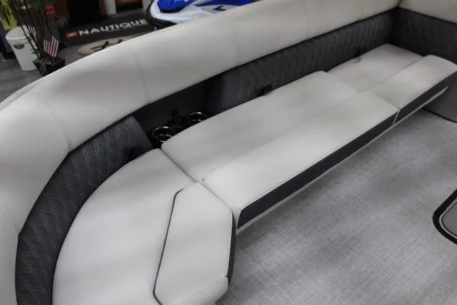 Slide: The Image of 2024 Harris Sunliner 250 SLDH boat interior with luxurious seating. - 9