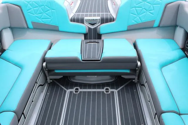 Slide: The Image of 2022 Nautique G23 Paragon interior with turquoise and gray seating, modern design. - 17