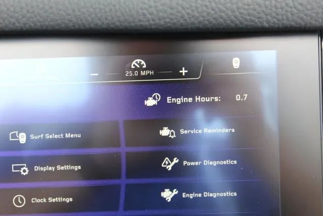 Slide: The Image of 2022 Nautique G23 Paragon dashboard displaying engine hours and diagnostics menu. - 26