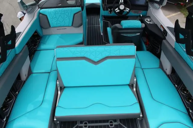 Slide: The Image of 2022 Nautique G23 Paragon interior with turquoise seating and modern design. - 27