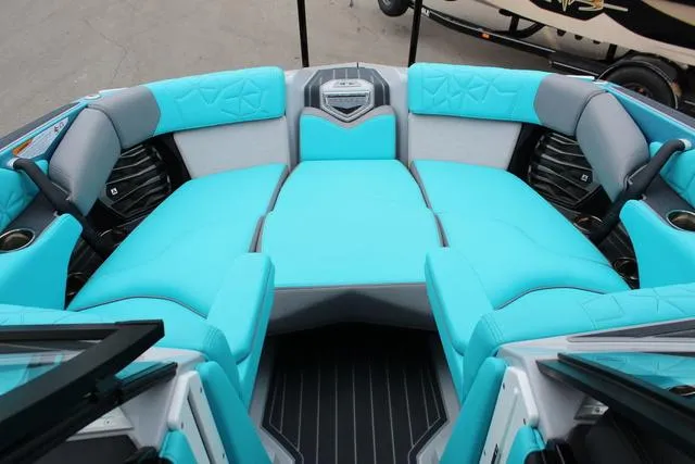 Slide: The Image of 2022 Nautique G23 Paragon boat interior with turquoise seating and modern design. - 33