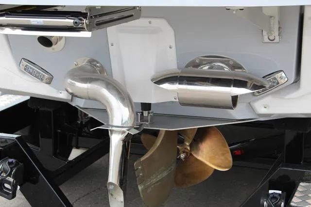 Slide: The Image of Close-up of 2022 Nautique G23 Paragon boat propeller and exhaust system. - 5
