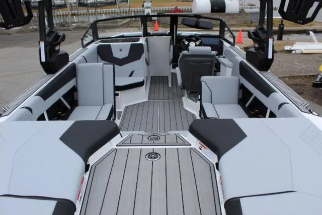 Slide: The Image of 2024 Nautique Super Air Nautique GS22 interior with sleek seating and modern design. - 13