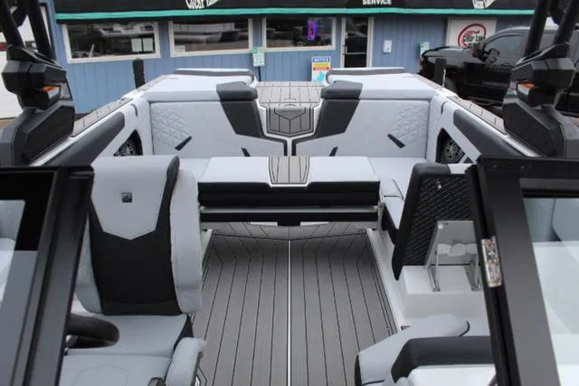 Slide: The Image of 2024 Nautique Super Air Nautique GS22 interior with sleek seating and modern design. - 15