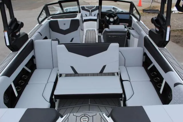 Slide: The Image of 2024 Nautique Super Air Nautique GS22 interior with modern seating and sleek design. - 16