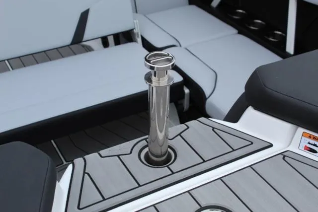 Slide: The Image of 2024 Nautique Super Air Nautique GS22 interior with sleek seating and polished details. - 18