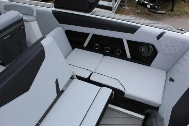 Slide: The Image of 2024 Nautique Super Air Nautique GS22 interior seating with modern design and premium upholstery. - 21