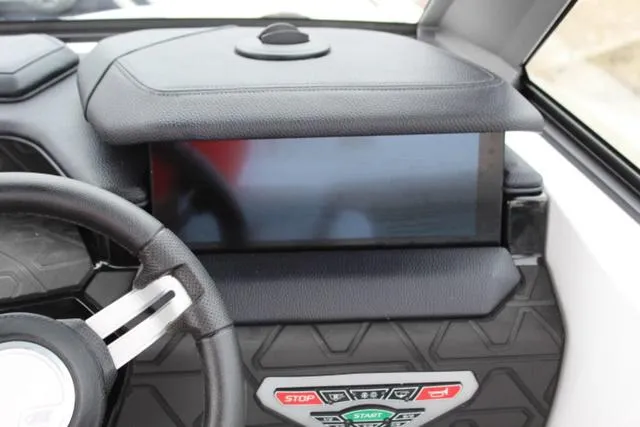 Slide: The Image of 2024 Nautique Super Air Nautique GS22 dashboard with touchscreen and controls. - 26