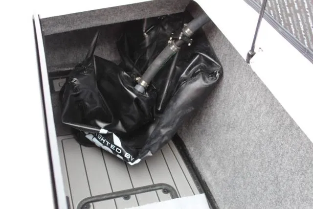Slide: The Image of 2024 Nautique Super Air Nautique GS22 ballast system in storage compartment. - 28