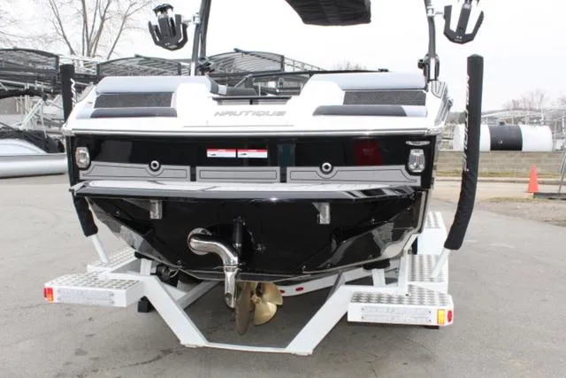 Slide: The Image of 2024 Nautique Super Air Nautique GS22 boat on trailer, rear view. - 9