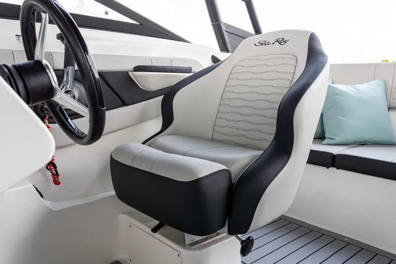 Slide: The Image of Captain's seat in 2023 Sea Ray SPX 190 boat, featuring sleek design and comfortable upholstery. - 15