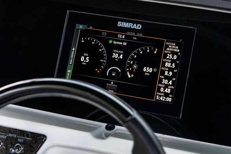 Slide: The Image of Simrad display on 2023 Sea Ray SPX 190 boat dashboard showing navigation and engine data. - 19