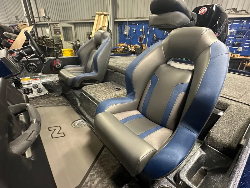 Slide: The Image of 2025 Nitro Z21 XL Pro boat interior with blue and gray seats. - 10
