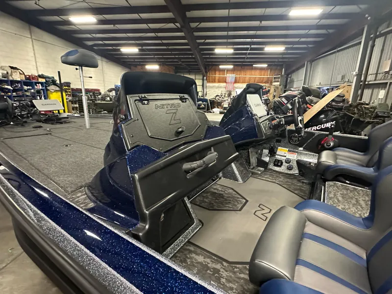 Slide: The Image of 2025 Nitro Z21 XL Pro boat interior in a warehouse setting. - 11