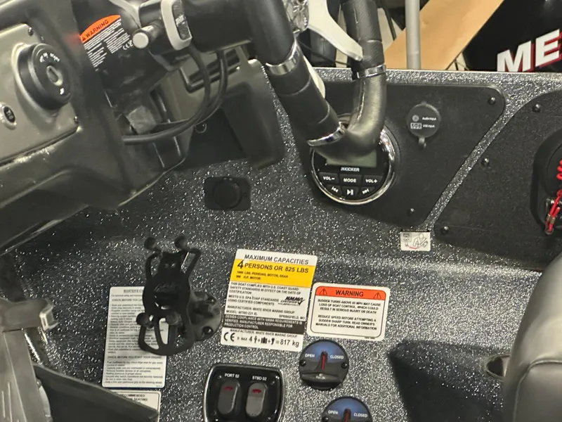 Slide: The Image of Control panel of 2025 Nitro Z21 XL Pro boat with gauges and warning labels. - 14