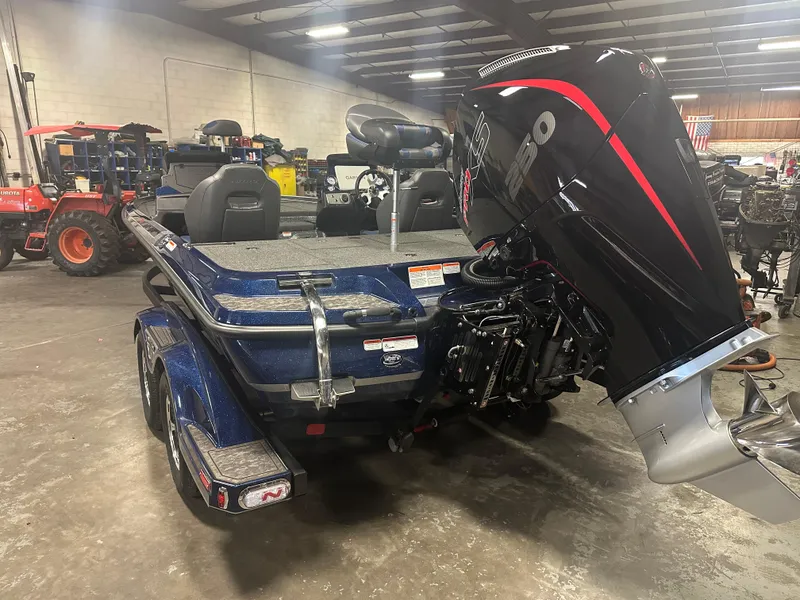 Slide: The Image of 2025 Nitro Z21 XL Pro boat in a warehouse, featuring a powerful outboard motor. - 3