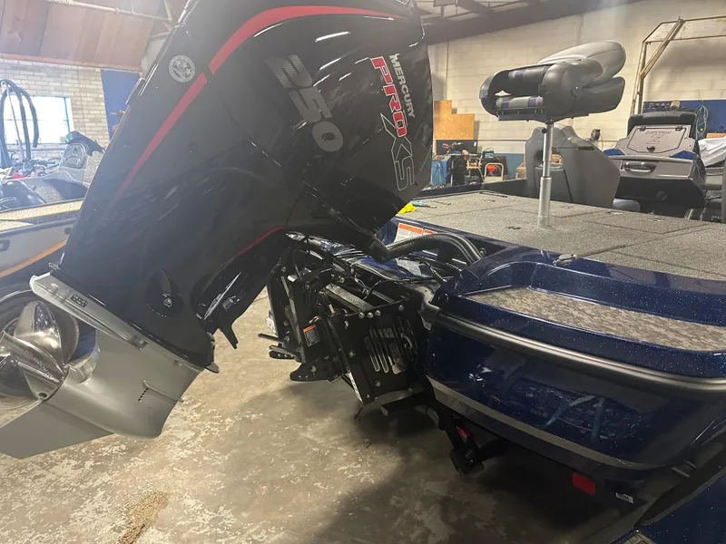 Slide: The Image of 2025 Nitro Z21 XL Pro boat with powerful outboard motor in a garage setting. - 4