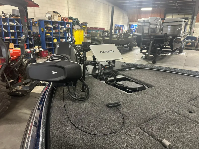 Slide: The Image of 2025 Nitro Z21 XL Pro boat with Garmin equipment in a workshop setting. - 6