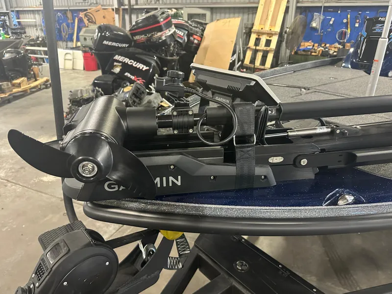 Slide: The Image of 2025 Nitro Z21 XL Pro boat with Garmin trolling motor in a workshop. - 7