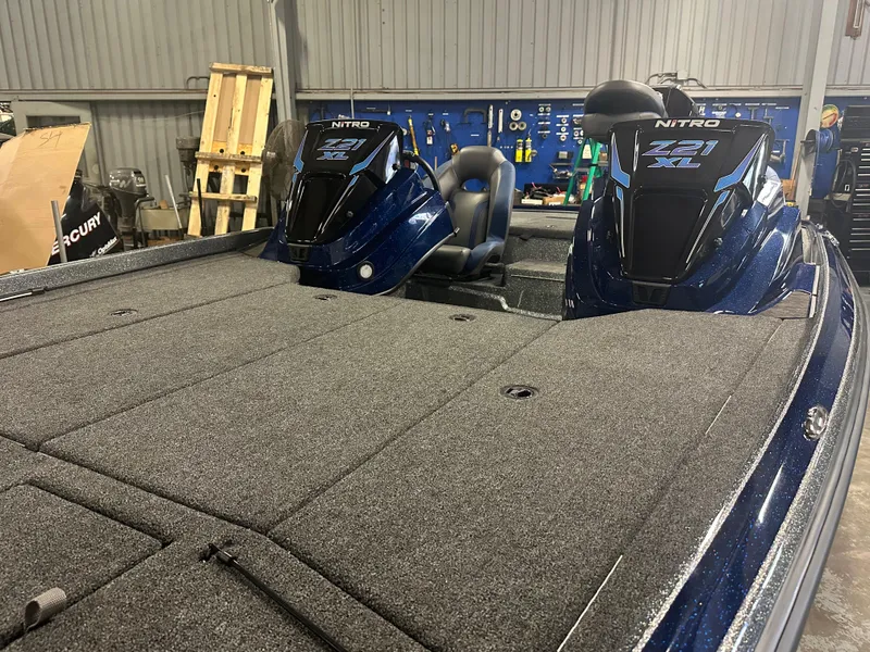 Slide: The Image of 2025 Nitro Z21 XL Pro boat in a workshop setting. - 8
