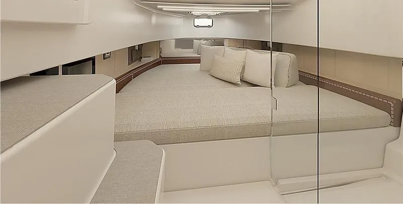 Slide: The Image of 2025 Wellcraft 38 T-Top cabin interior with spacious bed and modern design. - 10