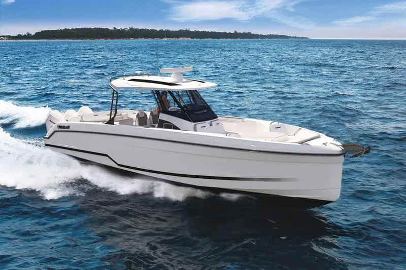 Slide: The Image of 2025 Wellcraft 38 T-Top boat cruising on open water. - 2