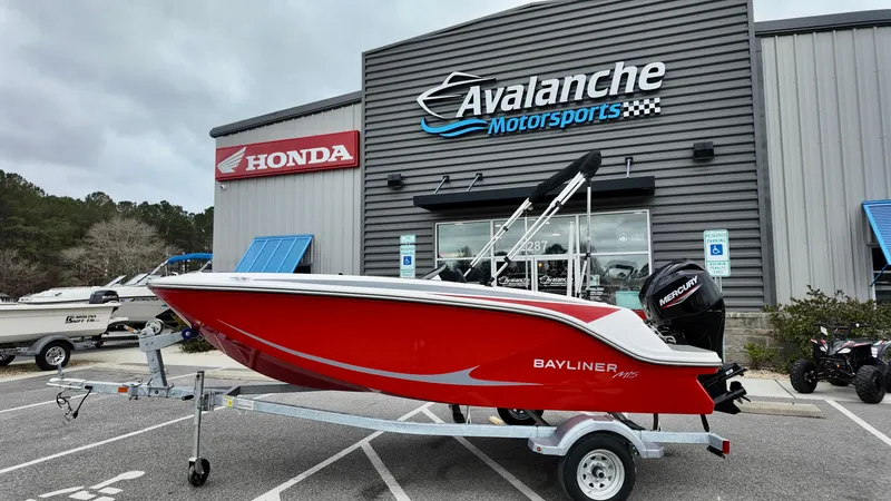 The Image of 2025 Bayliner M15 boat in red on trailer at Avalanche Motorsports dealership. - 0