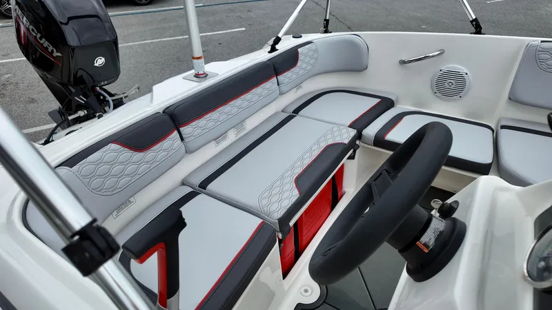 Slide: The Image of 2025 Bayliner M15 boat interior with modern seating and steering wheel. - 8