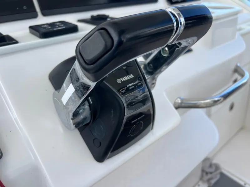Slide: The Image of Yamaha throttle control on 2014 Everglades 350LX boat dashboard. - 17