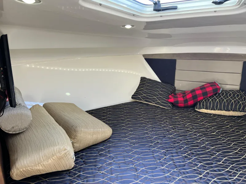 Slide: The Image of Cozy cabin interior of 2014 Everglades 350LX with comfortable bedding and pillows. - 31
