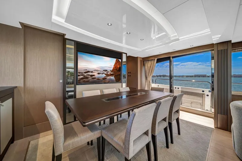 Slide: The Image of Luxurious dining area on 2021 Sunseeker 86 Yacht with ocean view. - 18