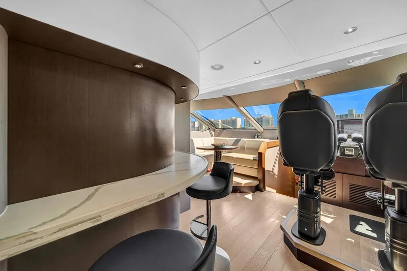 Slide: The Image of Luxurious interior of 2021 Sunseeker 86 Yacht with modern seating and panoramic windows. - 24