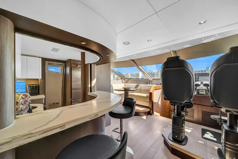 Slide: The Image of Luxurious interior of 2021 Sunseeker 86 Yacht with modern helm and seating area. - 25