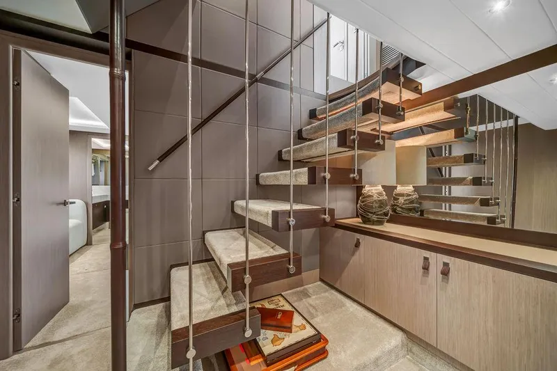 Slide: The Image of Luxurious interior staircase of 2021 Sunseeker 86 Yacht, featuring modern design and elegant decor. - 30