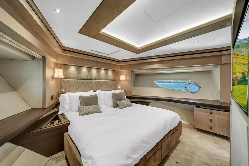 Slide: The Image of Luxurious Sunseeker 86 Yacht 2021 bedroom with elegant decor and scenic window view. - 32