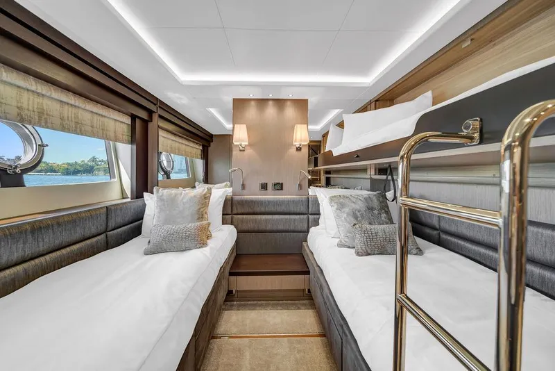 Slide: The Image of Luxurious 2021 Sunseeker 86 Yacht cabin with twin beds and elegant decor. - 41