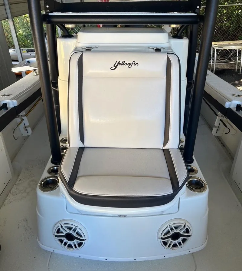 Slide: The Image of 2020 Yellowfin 26 boat seat with integrated speakers and cup holders. - 6