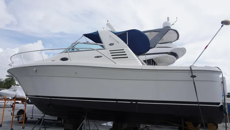Slide: The Image of 2002 Sea Ray 340 Amberjack boat on dry dock, side view. - 1