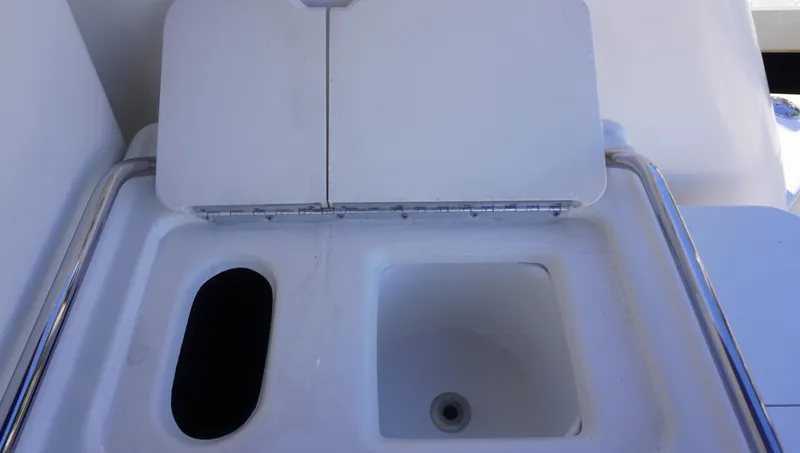 Slide: The Image of Sea Ray 340 Amberjack 2002 boat sink and storage compartment. - 12
