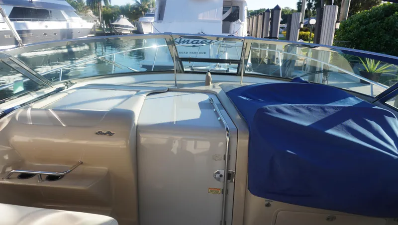 Slide: The Image of 2002 Sea Ray 340 Amberjack boat interior with windshield and seating area. - 13