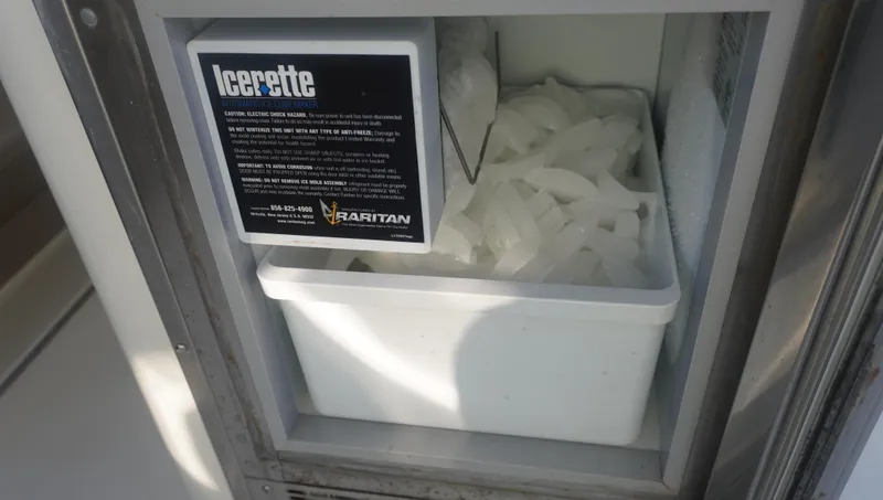 Slide: The Image of Ice maker on 2002 Sea Ray 340 Amberjack boat, filled with ice cubes. - 15