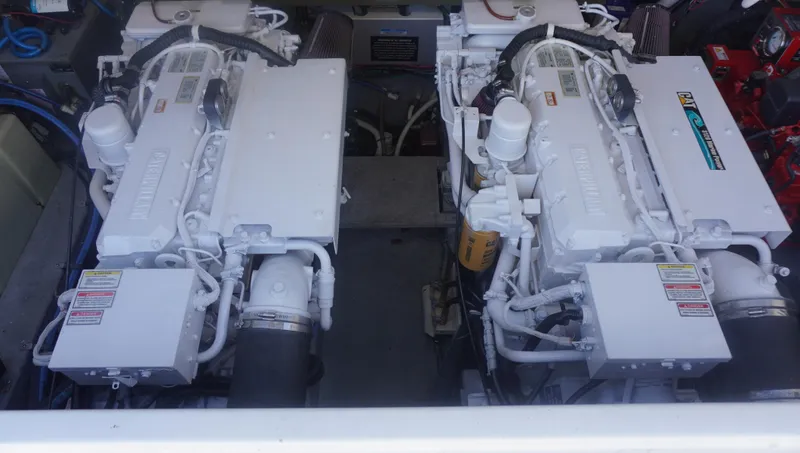 Slide: The Image of Twin engines of a 2002 Sea Ray 340 Amberjack boat. - 21
