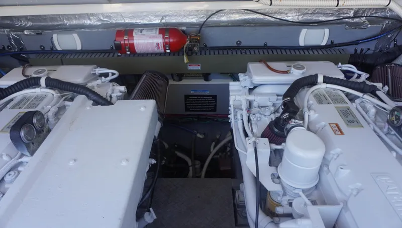 Slide: The Image of Engine compartment of 2002 Sea Ray 340 Amberjack with fire extinguisher. - 22