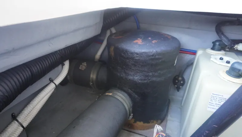 Slide: The Image of Engine compartment of 2002 Sea Ray 340 Amberjack with hoses and components. - 26