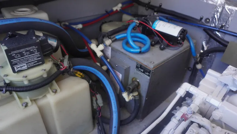 Slide: The Image of Engine compartment of 2002 Sea Ray 340 Amberjack with visible wiring and components. - 27