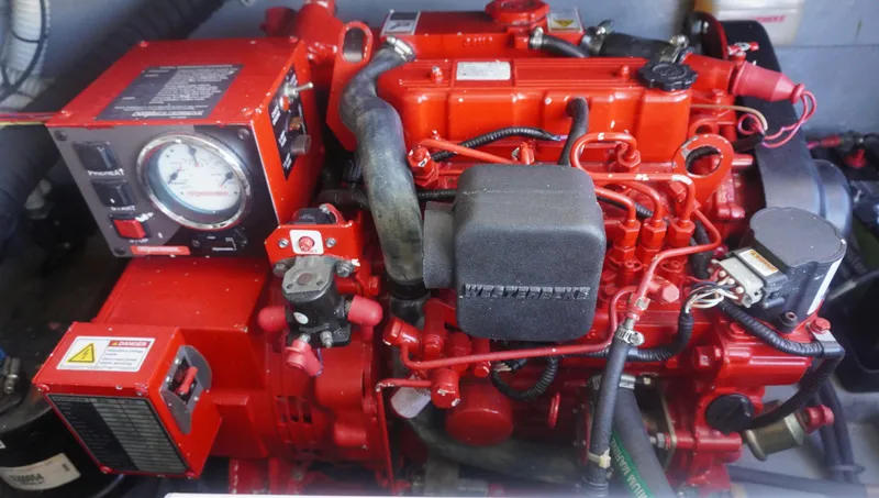 Slide: The Image of Red engine of a 2002 Sea Ray 340 Amberjack boat, showcasing detailed components. - 29