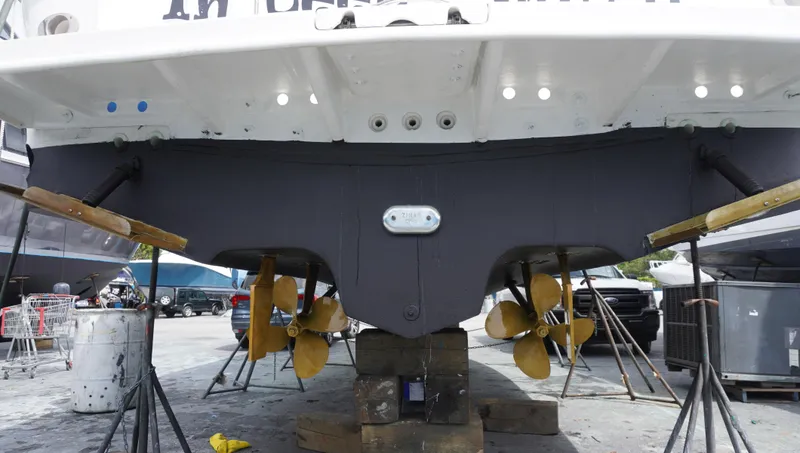 Slide: The Image of 2002 Sea Ray 340 Amberjack boat hull and propellers in dry dock. - 3