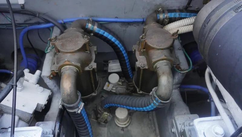 Slide: The Image of Engine compartment of 2002 Sea Ray 340 Amberjack with visible hoses and components. - 30
